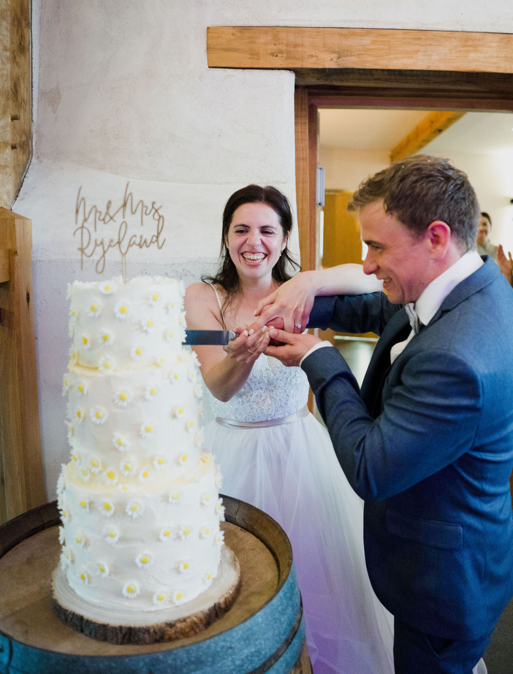 Upton Barn and Walled Gardens wedding, the bride and groom cut the cake.