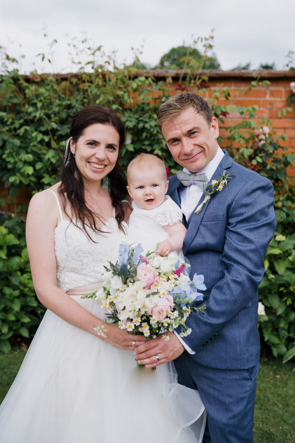 Upton Barn and Walled Gardens wedding, the bride, groom and daughter.