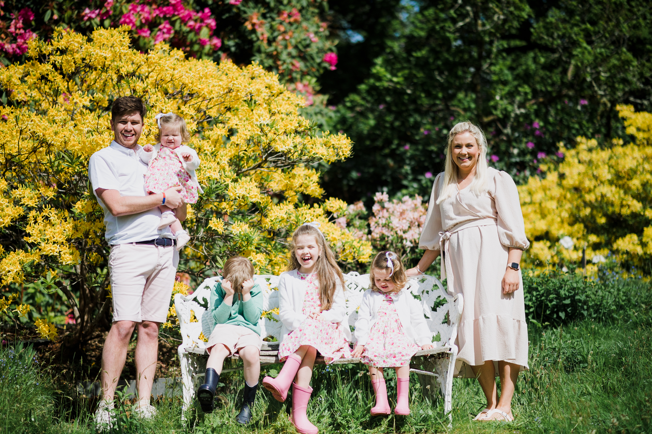Family stood in the gardens of Pentillie Castle captured by Cornwall Family Photographer Liberty Pearl